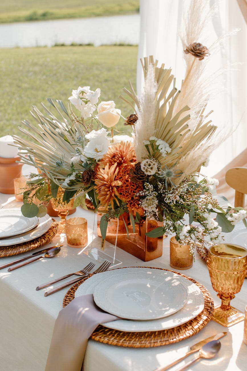 white and brown flowers on brown wooden vase